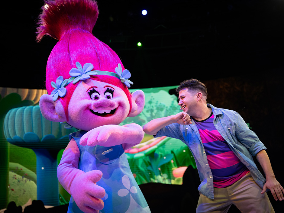 Poppy and a performer in DreamWorks Imagination Celebration