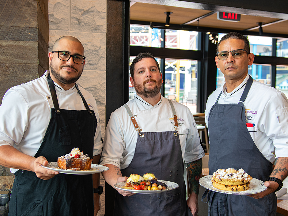 Bigfire chefs holding their respective Sunday brunch dishes at Universal CityWalk.