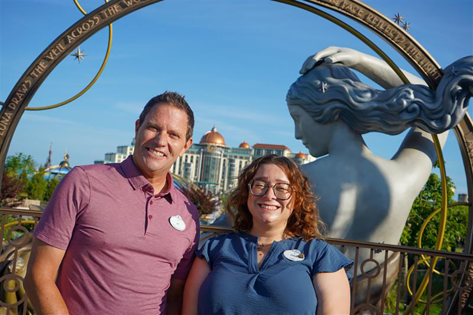 JC and Gina pose by the Luna statue in celestial Park