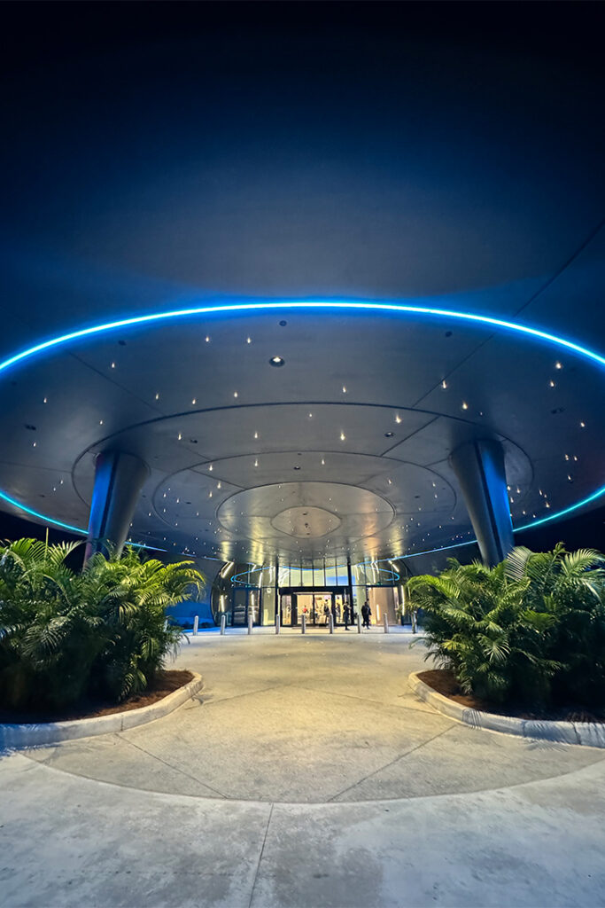 The entrance to Stella Nova lit up at night