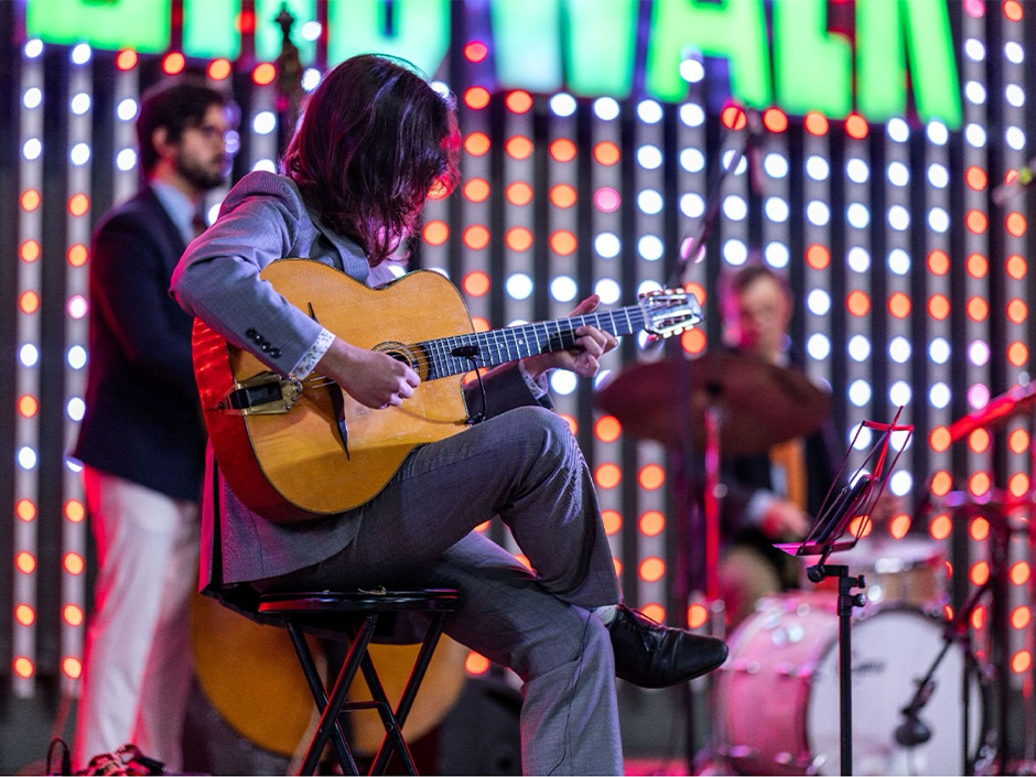 A guitarist performs at the 5 Towers Stage at Universal CityWalk Hollywood. 