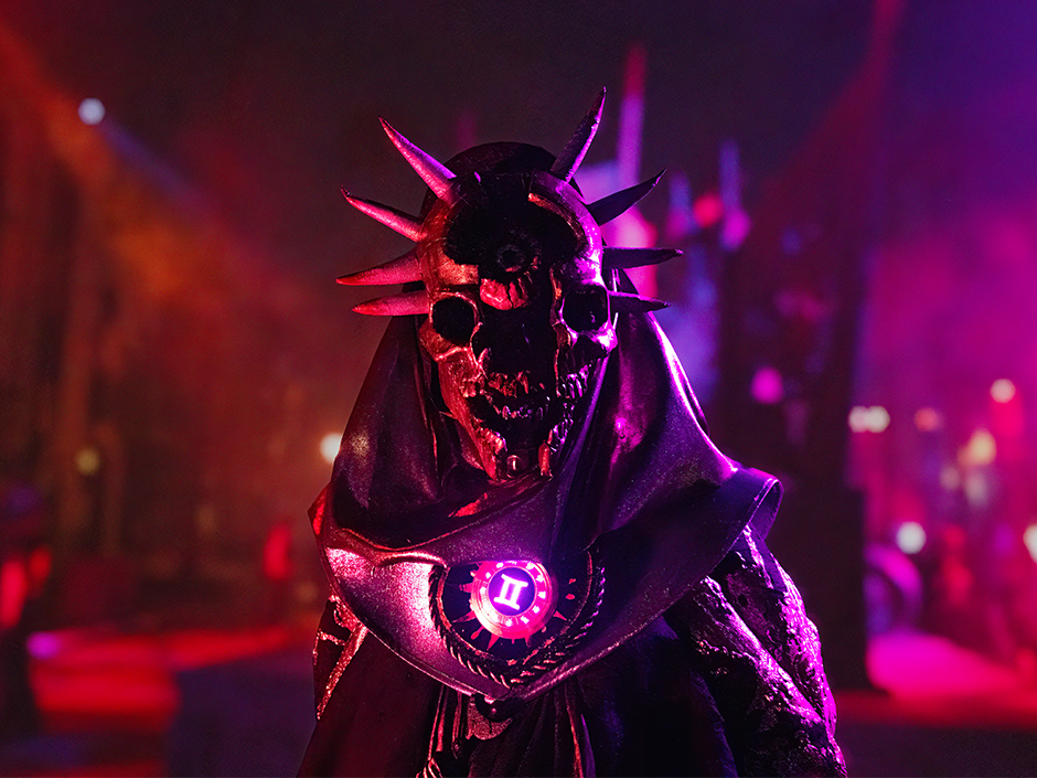 A scare actor in the Dark Zodiac scare zone from Halloween Horror Nights 2024
