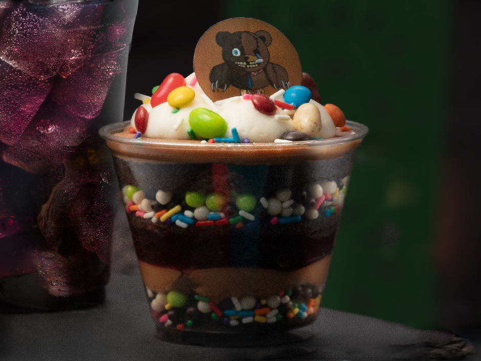 HamiKuma-themed dessert made of an array of candies and chocolate.