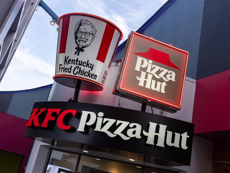 Signs reading "Kentucky Fried Chicken" and "Pizza Hut" on CityWalk.