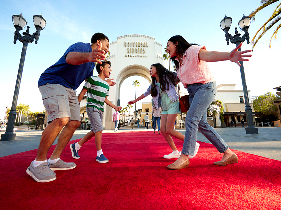 Family on red carpet outside of Universal Studios Hollywood arch.