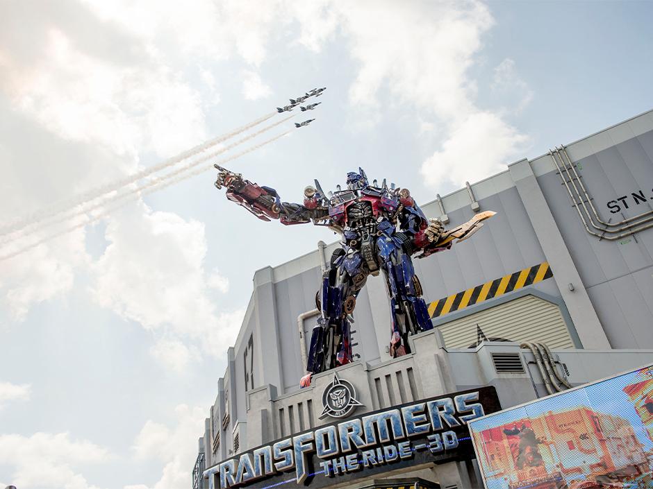 Jets fly through the sky above Transformers The Ride in Universal Studios Florida