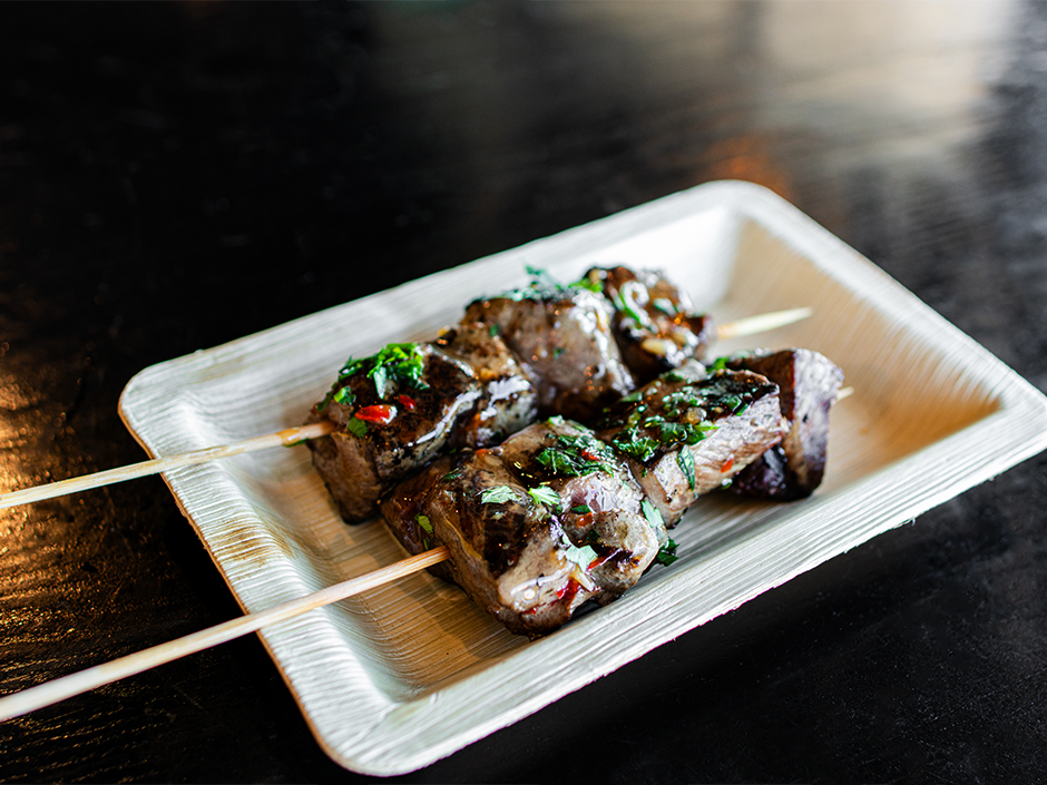 Plate of the Bourbon-Glazed Beef Kabobs at NBC Sports Grill & Brew for the Super Bowl Tailgate.