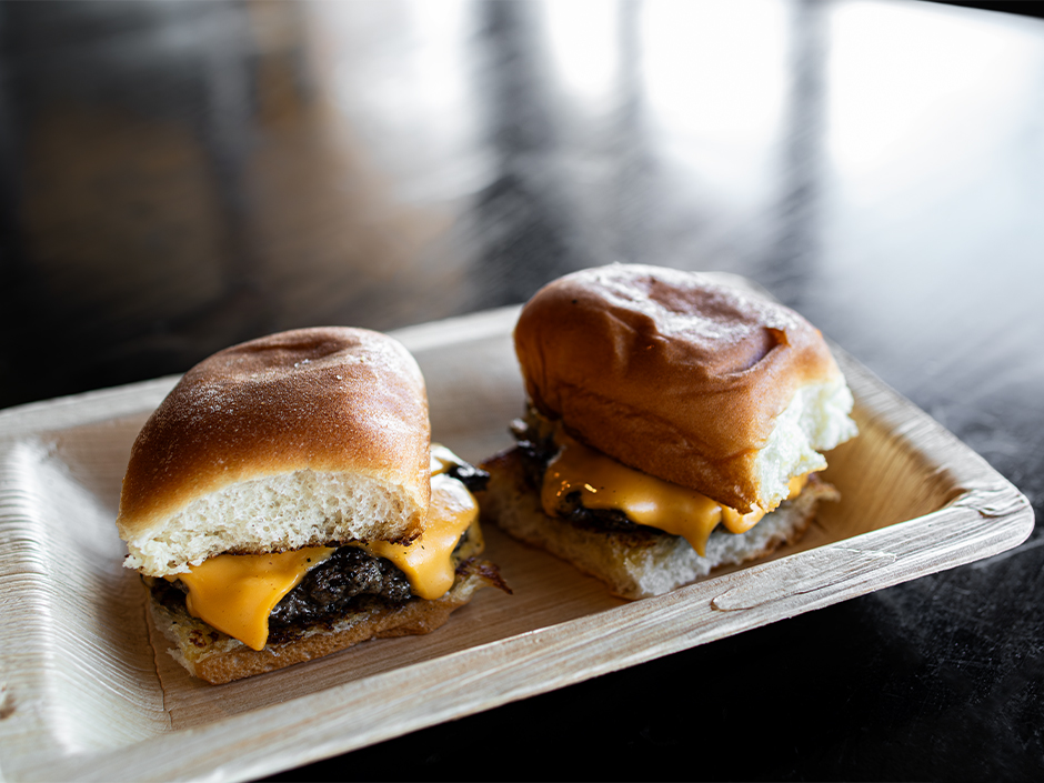 Plate of mini cheeseburgers at NBC Sports Grill & Brew for the Super Bowl Tailgate.