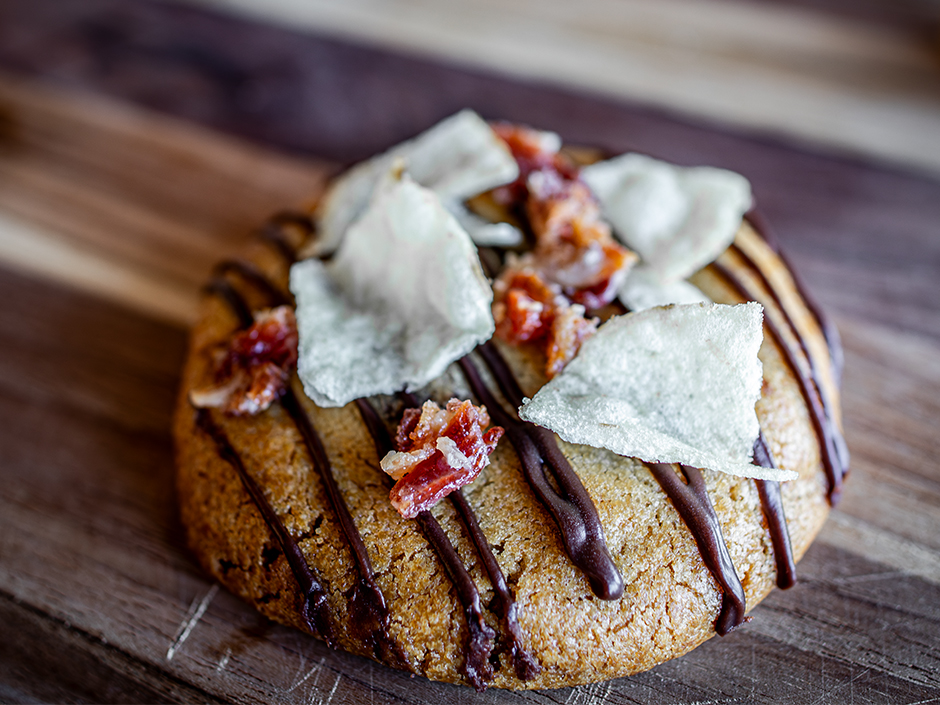 Chocolate Chip Cookie topped with potato chips and candied bacon