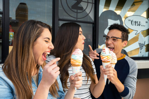 A group of kids enjoying ice cream at Universal Studios Hollywood.