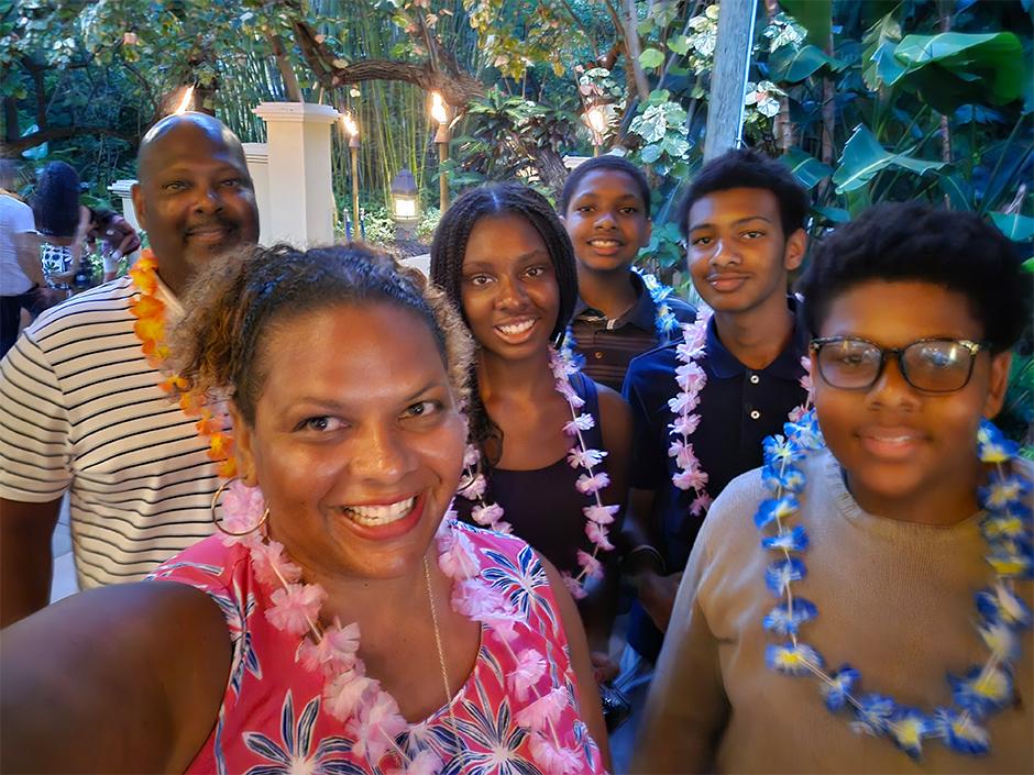 Maria Smith with her husband and children taking a selfie at Loews Royal Pacific Resort.