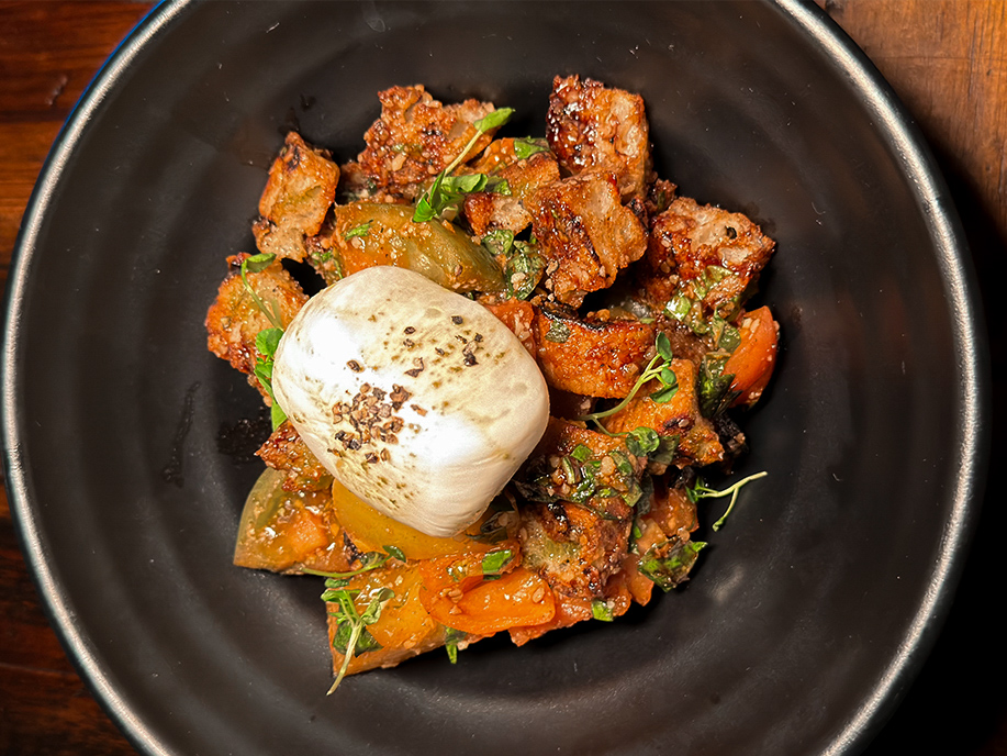 An appetizer dish for the Bloody Valentine menu at Universal Horror Unleashed; tomatoes with burrata cheese