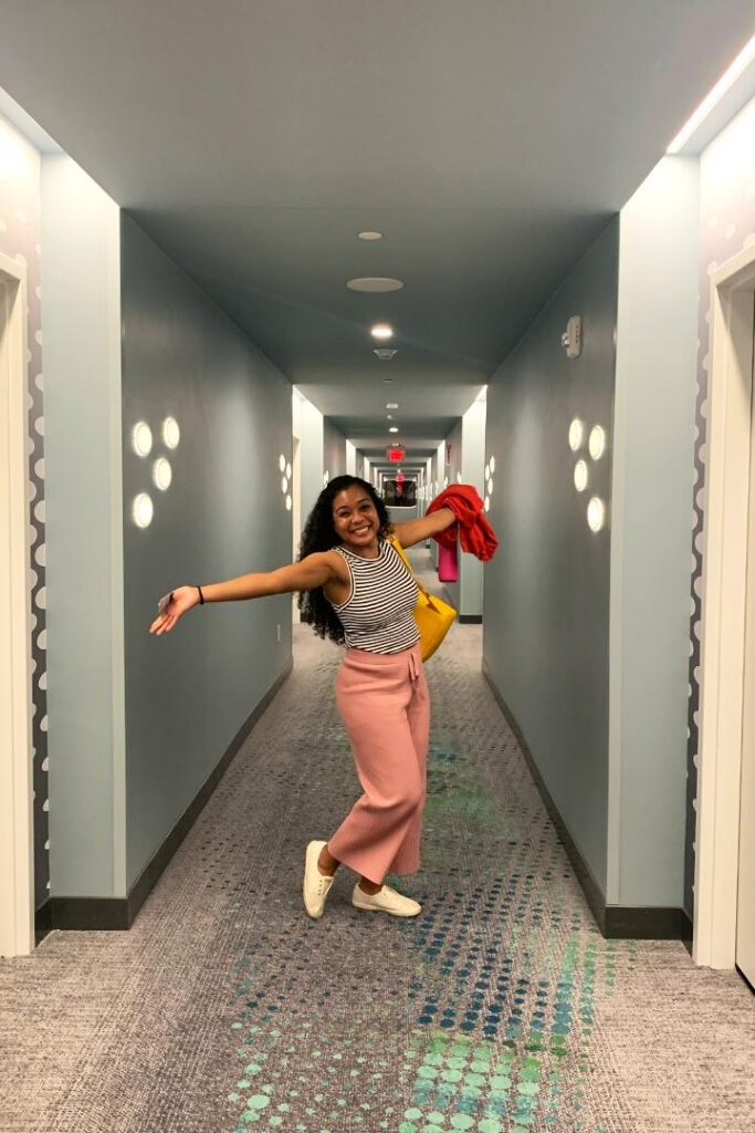 Danielle poses for a photo in the hallway of Universal Terra Luna Resort