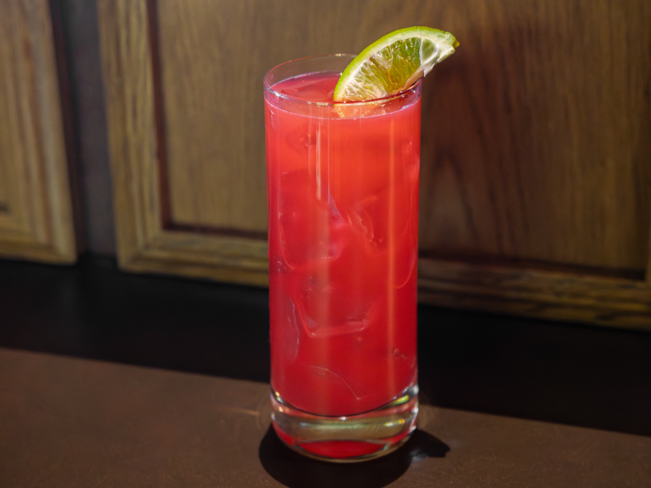A tall glass of The Woman to Blame cocktail at Jimmy Buffett's Margaritaville for Women's Herstory Month.