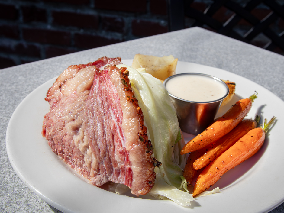 A St. Patrick's Day plate of smoked corned beef brisket, cabbage, boiled potatoes, roasted carrots, and a side of dill crème fraiche at Pat O'Brien's in Universal CityWalk.