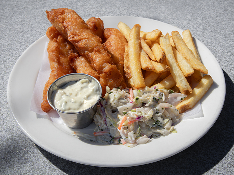 A plate of Fish & Chips with a side of coleslaw and tartar sauce at Pat O'Brien's in Universal CityWalk for St. Patrick's Day.