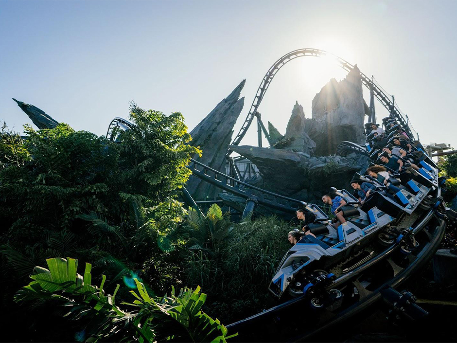 The sun shines across the track of Jurassic World VelociCoaster at Islands of Adventure