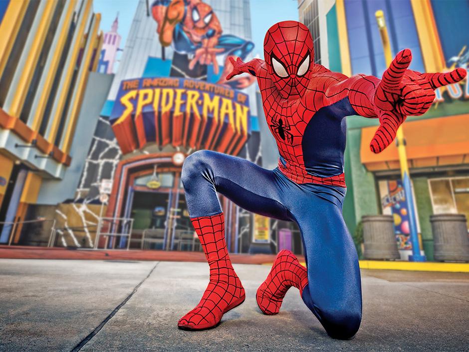 Spider-Man posing outside of The Amazing Adventures of Spider-Man ride.