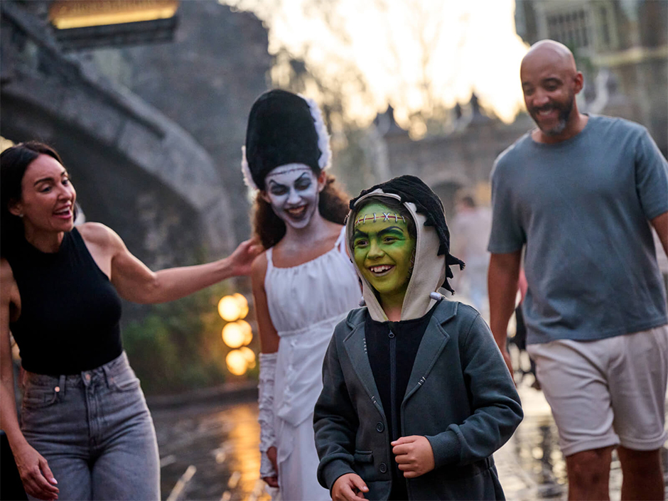 A family laughing with two kids in full Darkmoor Monster makeup.