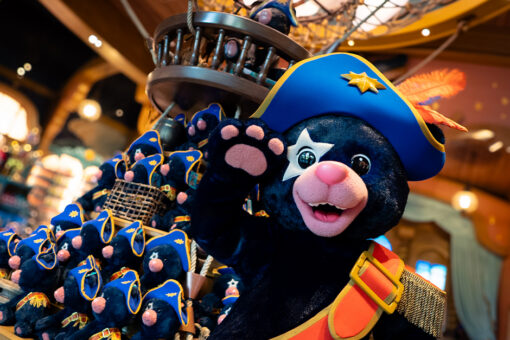 Captain Cacao salutes at the camera in Moonship Chocolates & Celestial Sweets at Universal Epic Universe