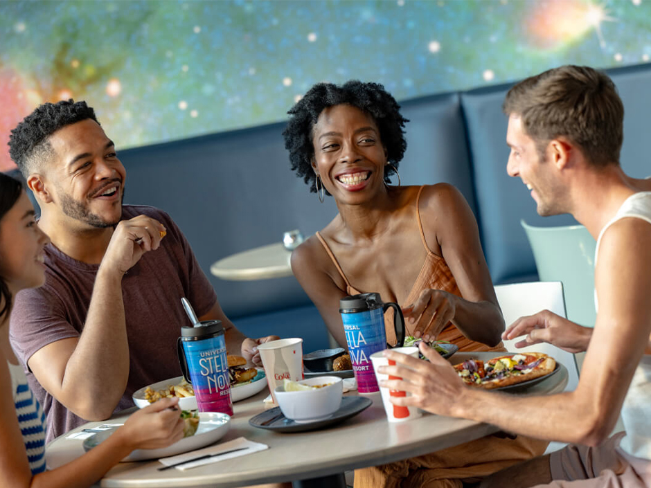 Friends dine at Cosmos Cafe at Stella Nova Resort.