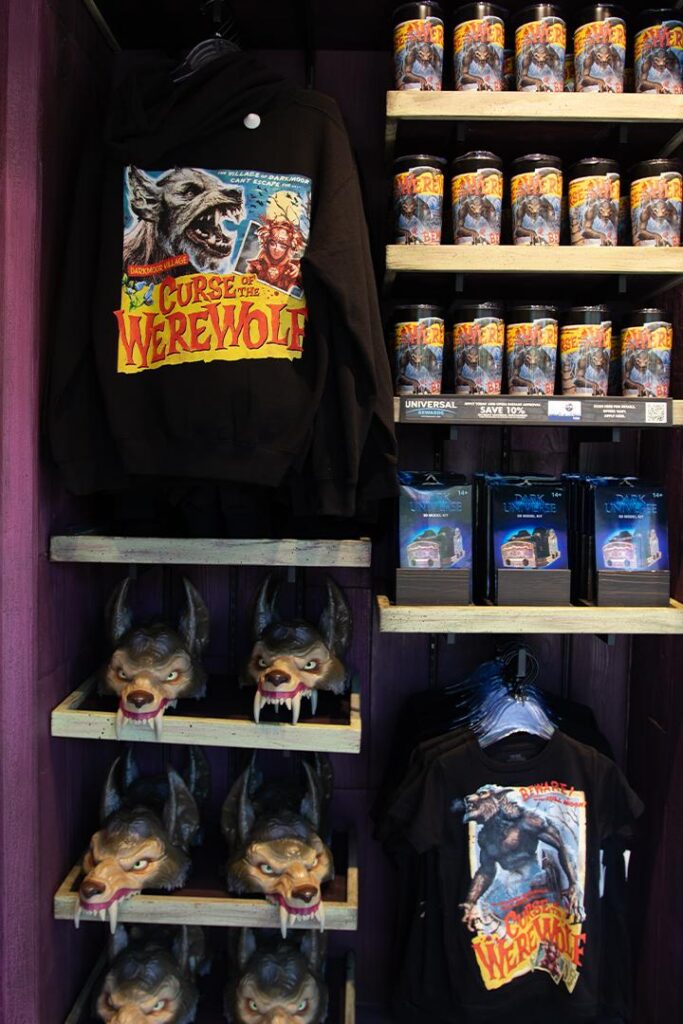A variety of Curse of the Werewolf merchandise, including a sweatshirt and cups.