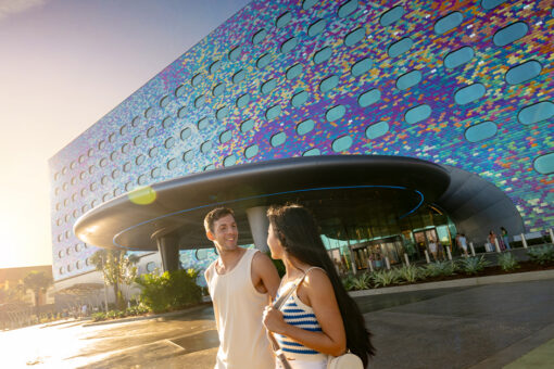 A couple walks outside of Stella Nova Resort.
