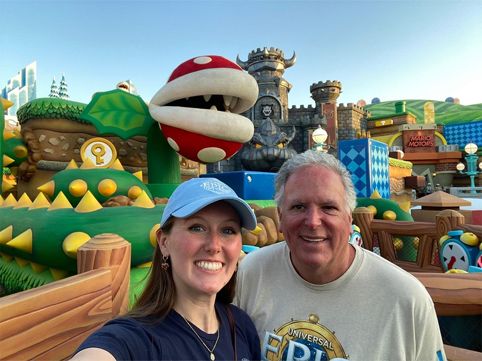 Kaitlyn and her dad smile in a selfie in SUPER NINTENDO WORLD