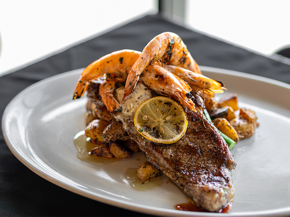 Plate of Land & Sea, a grilled steak and prawns dish, at NBC Sports Grill & Brew for Father's Day.