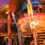 An exterior view of the Red Coconut Club at night.