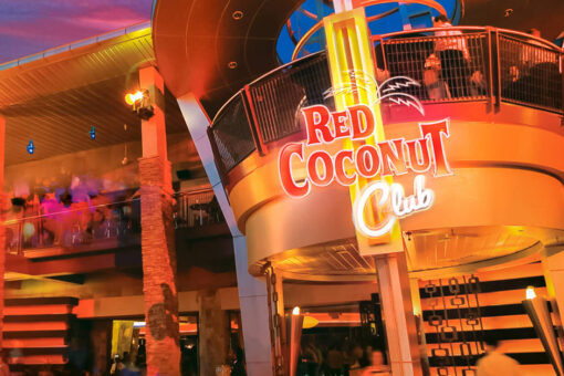An exterior view of the Red Coconut Club at night.