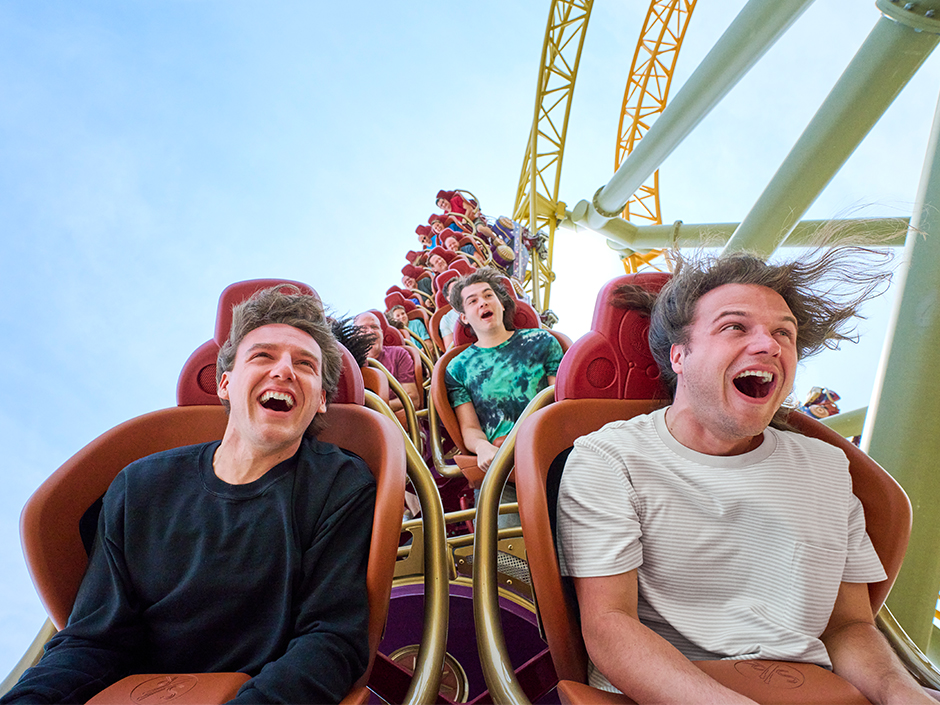 Guests smile as they ride Stardust Racers.