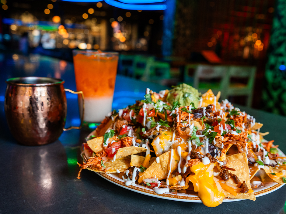 The Hat Trick Nachos, available at Antojitos Cocina Mexicana for the FIFA World Cup 2026.