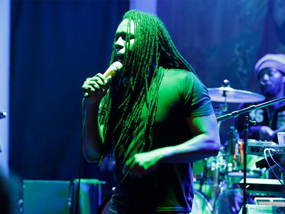 A singer performs on stage at Bob Marley-A Tribute to Freedom in Universal CityWalk