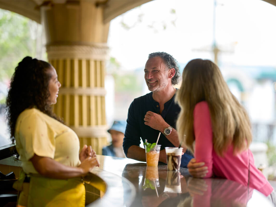 Three friends share drinks at Celestiki.