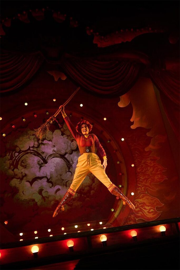An aerialist performs during Le Cirque Arcanus at Epic Universe