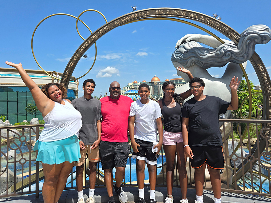 A photo of Maria and her family in front of Kronos