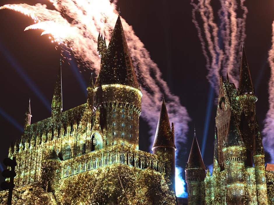 Fireworks and lights in front of Hogwarts Castle during Hogwarts Always in Hogsmeade Village