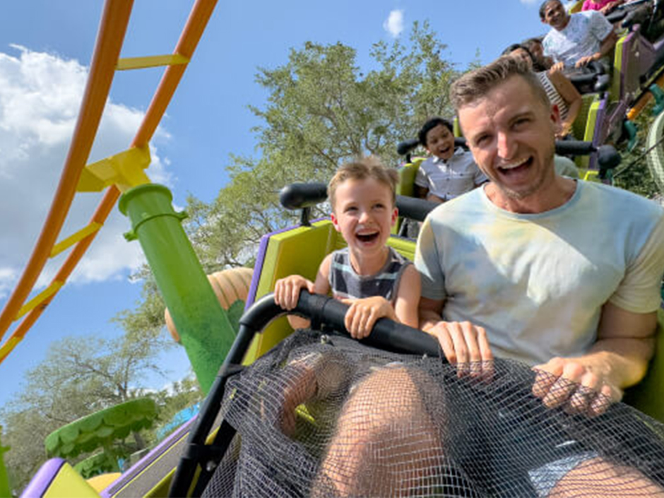 A boy and his father ride Trollercoaster.