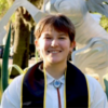 Headshot of Arley Scarborough in front of a Pegasus statue at UCF
