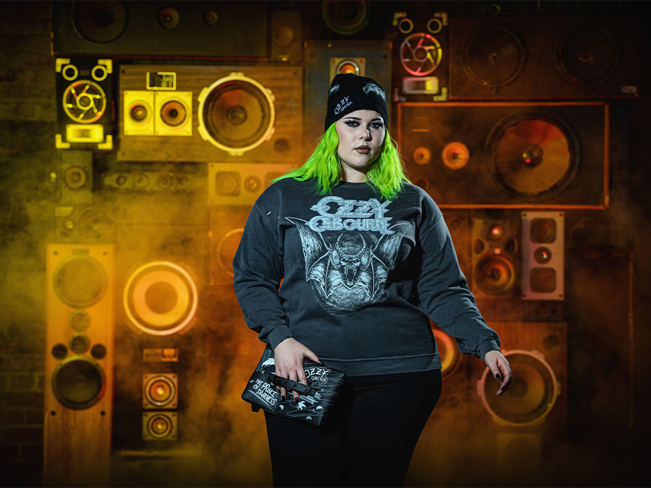 A guest poses in an Ozzy Osbourne shirt and beanie with a purse