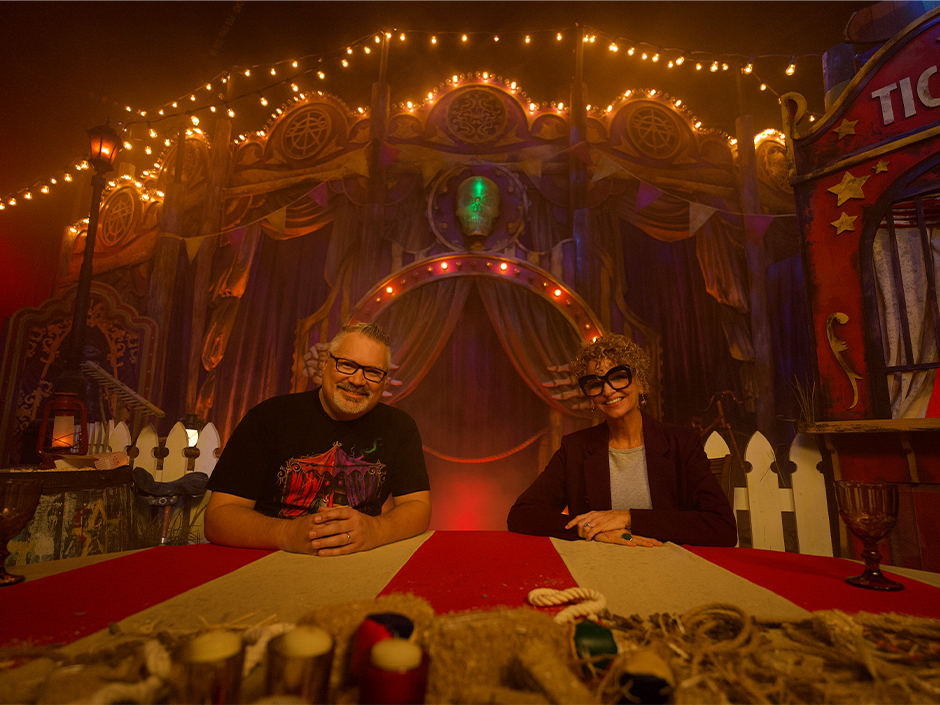 Charles Gray and Lora Sauls smile at the camera during their conversation about HHN on the HHN Podcast