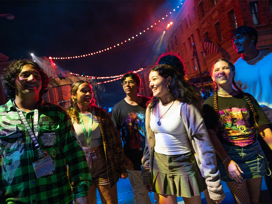 A group of friends walks through a scare zone at HHN