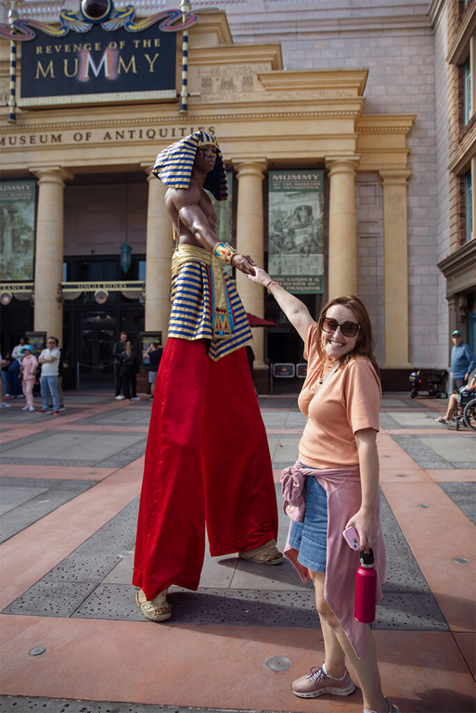 Laura interacts with a character outside of Revenge of the Mummy
