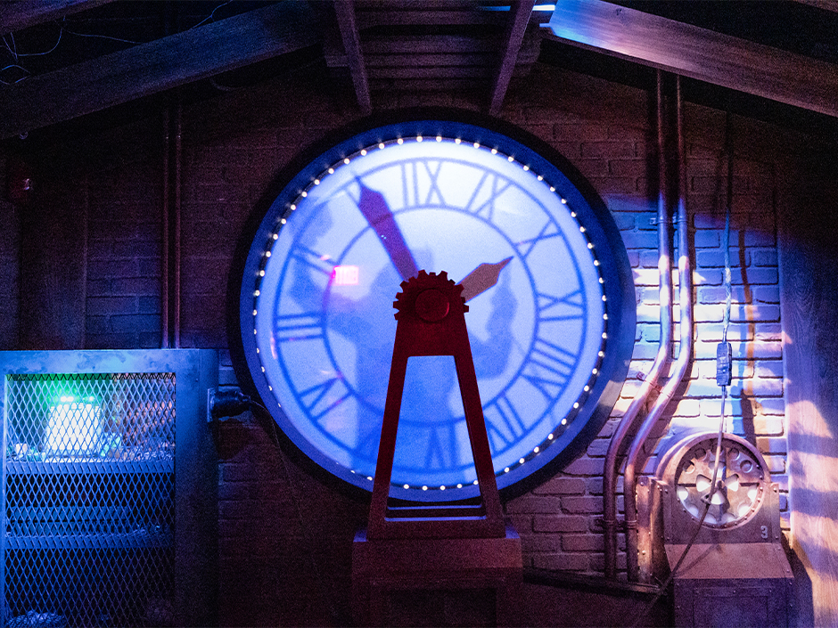 The silhouette of Doc Brown against the clock tower inside Universal's Great Movie Escape