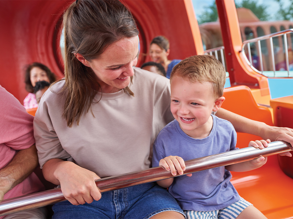 A mother and son enjoy a ride at Universal Kids Resort.