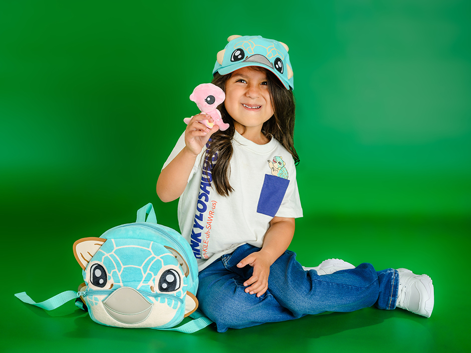 A little girl is wearing Jurassic World themed merchandise