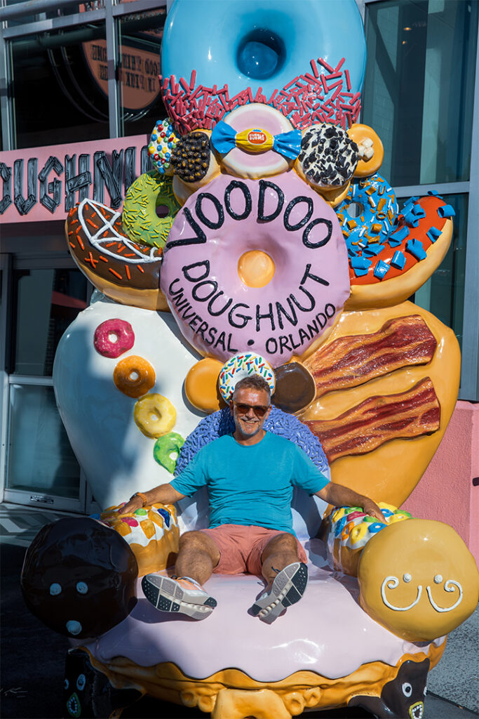 Fionn sitting on the Vooddo Doughnuts chair
