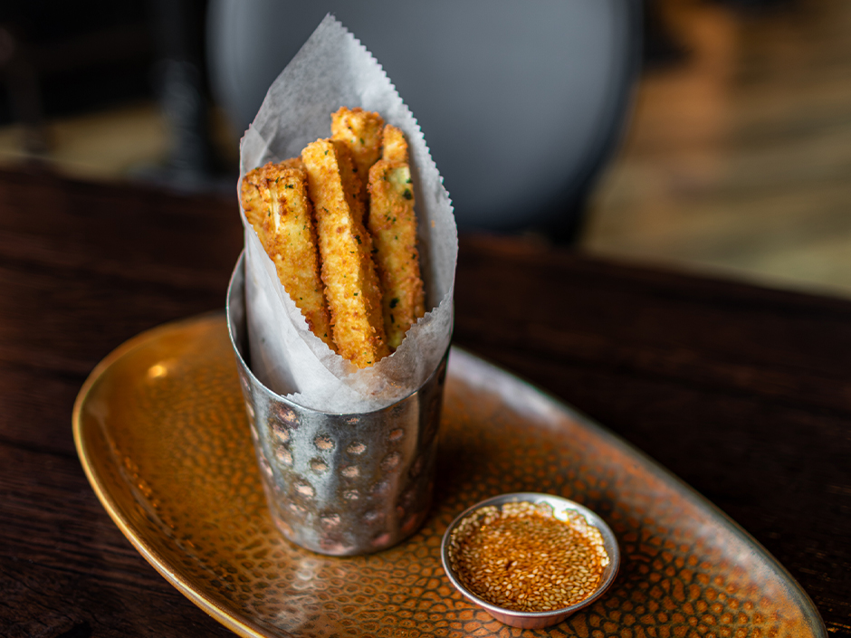 Plate of crispy zucchini with a side of sesame oil for dipping at Toothsome for the 10 year anniversary.