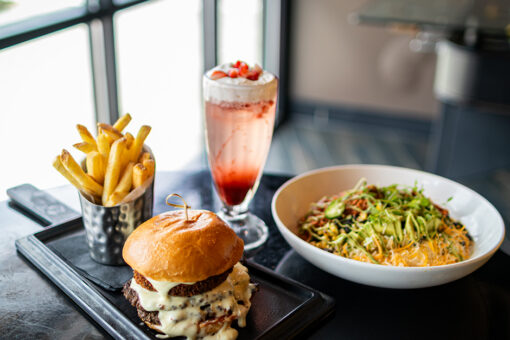 Plate of food and drinks for NFL Season at NBC Sports Grill & Brew in Universal CityWalk.